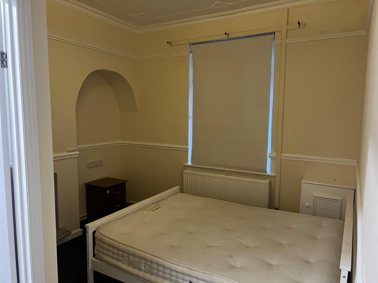 Finished double bedroom with retained period details