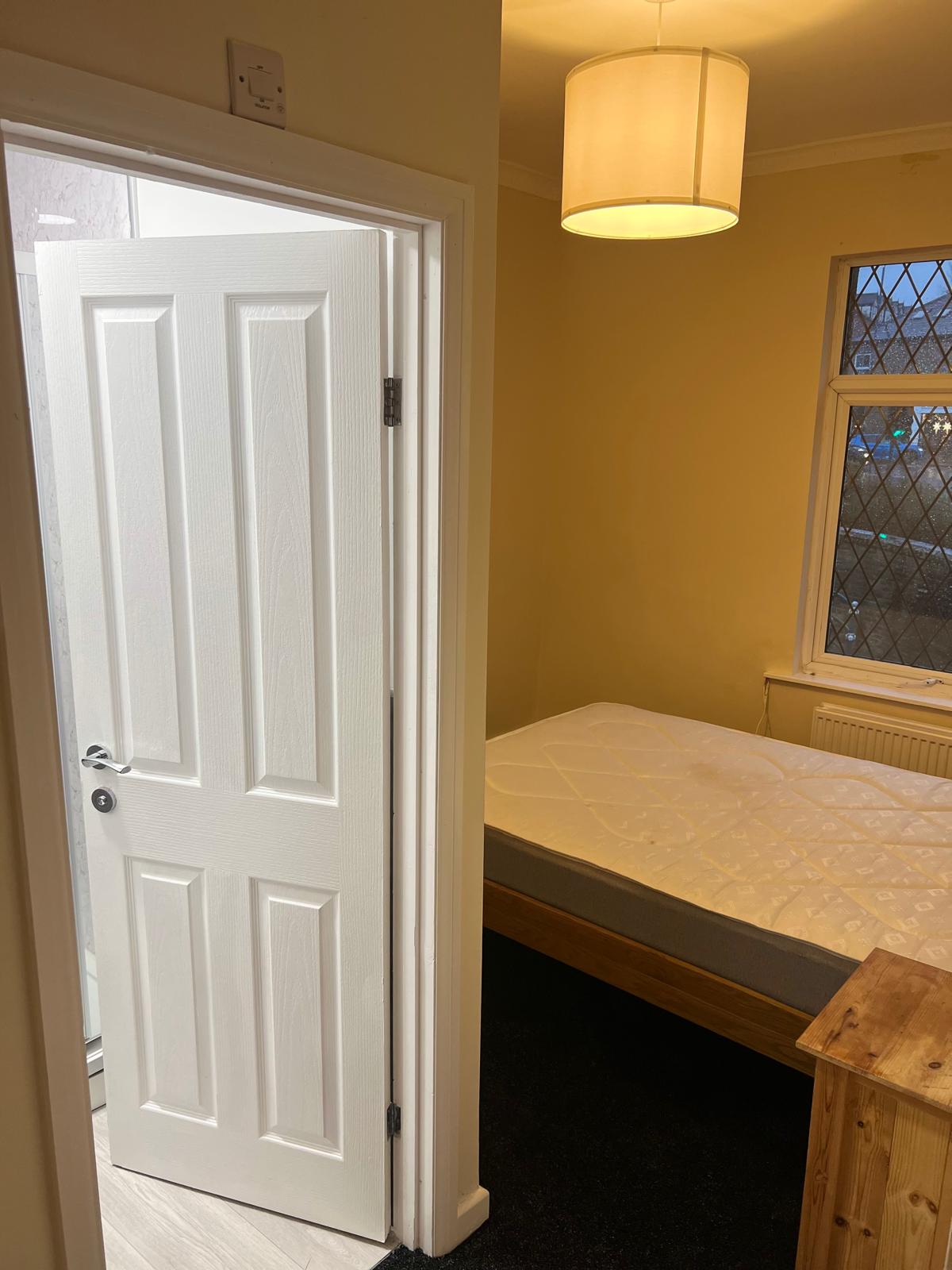 Converted bedroom positioned beside its new shower room