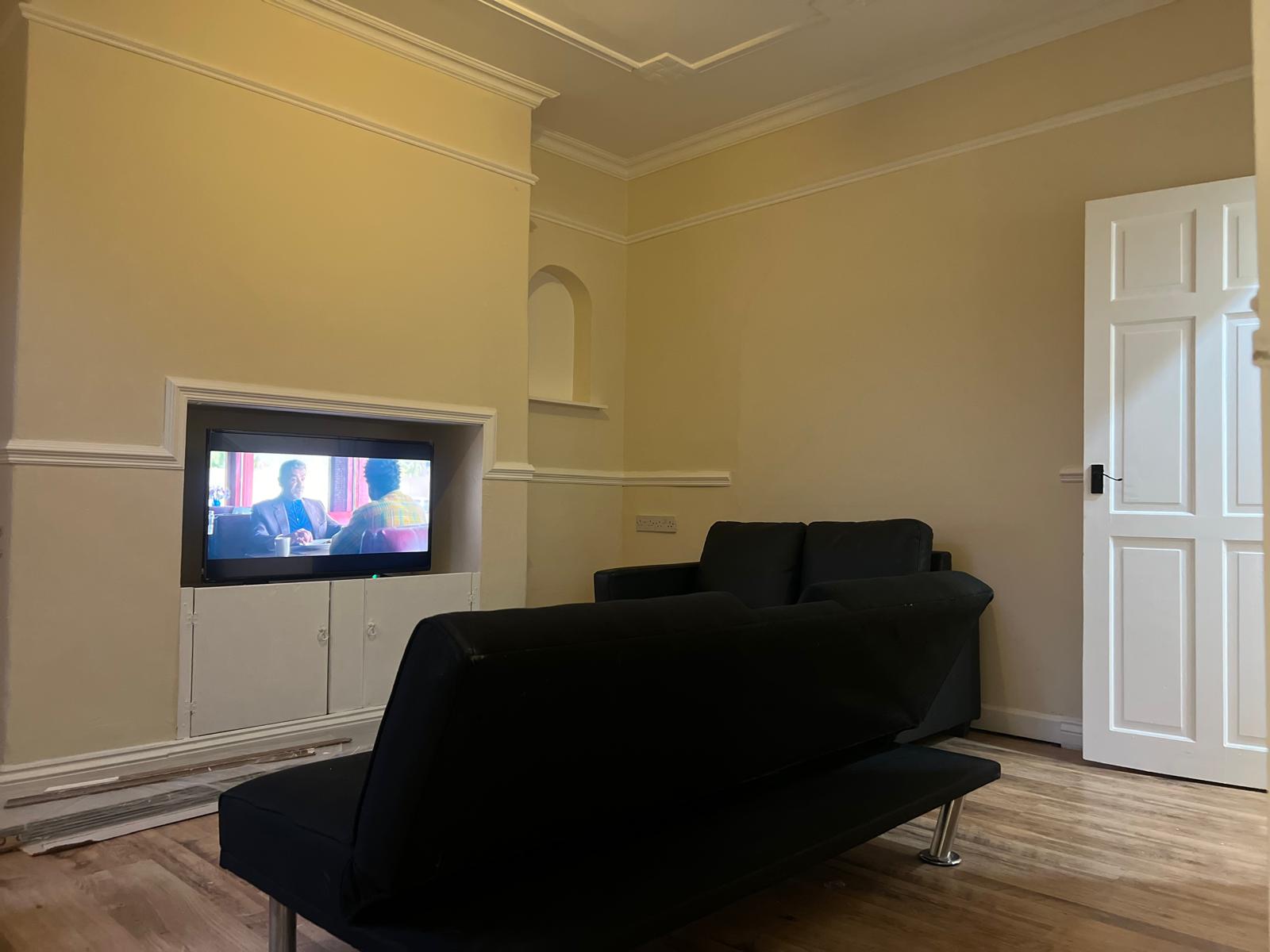 Refurbished main living room with original decorative mouldings