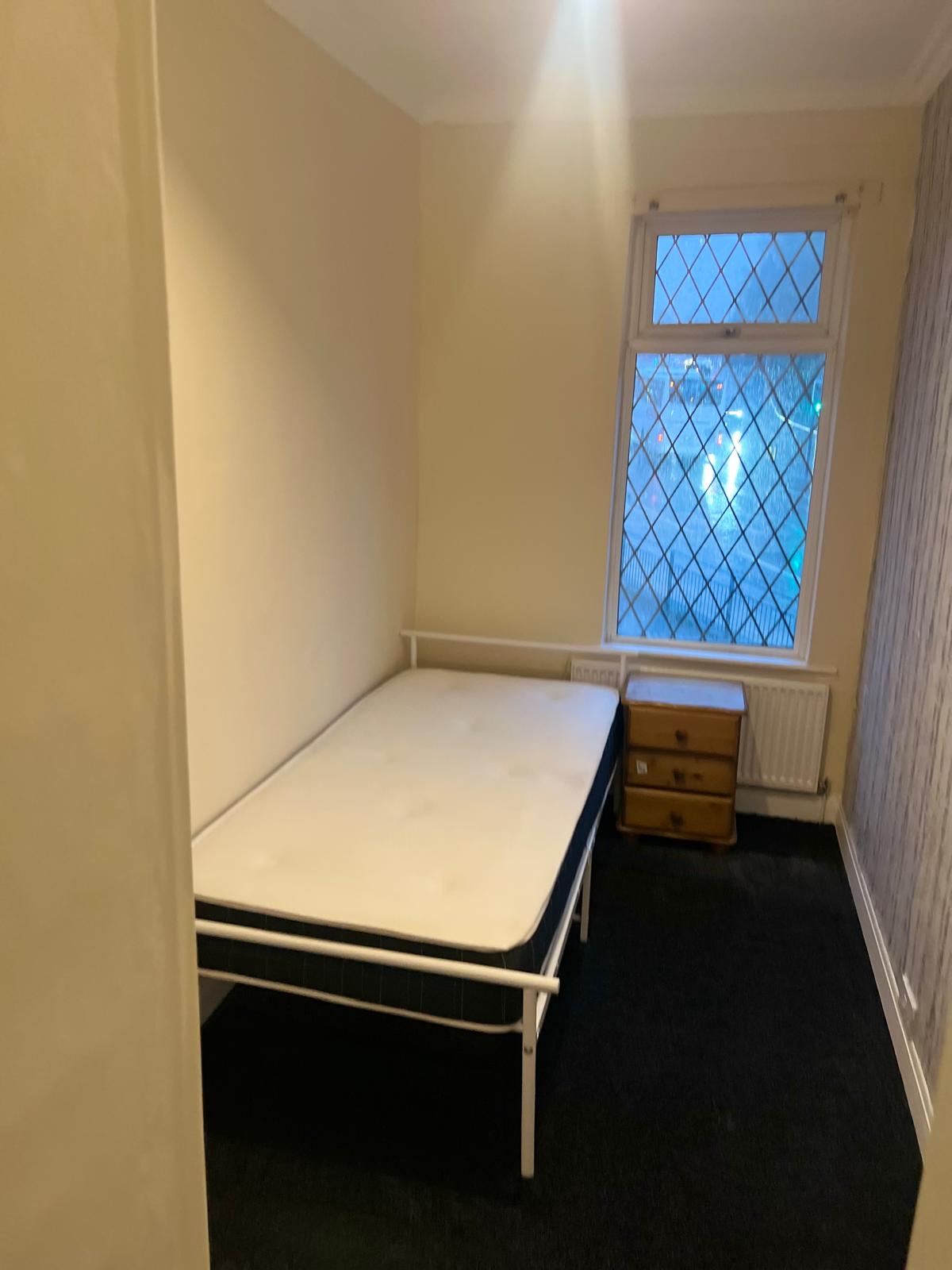 Finished single bedroom with leaded window