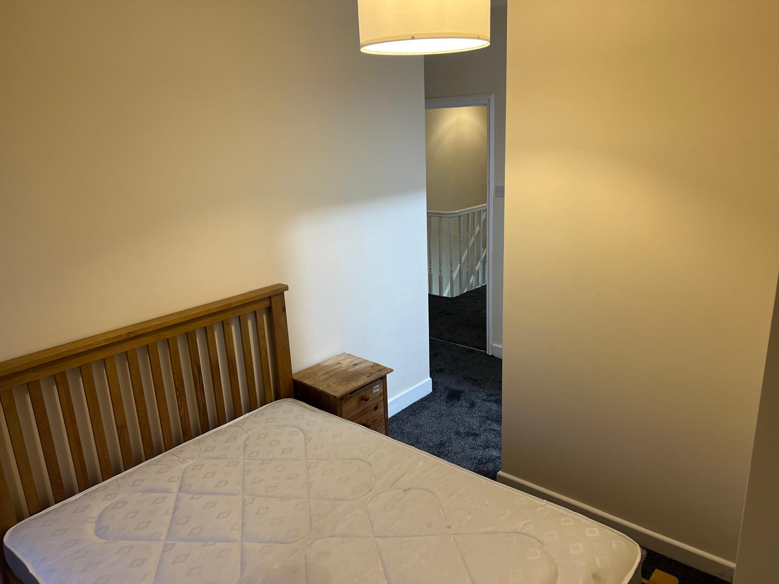 Completed double bedroom with refreshed walls and carpet