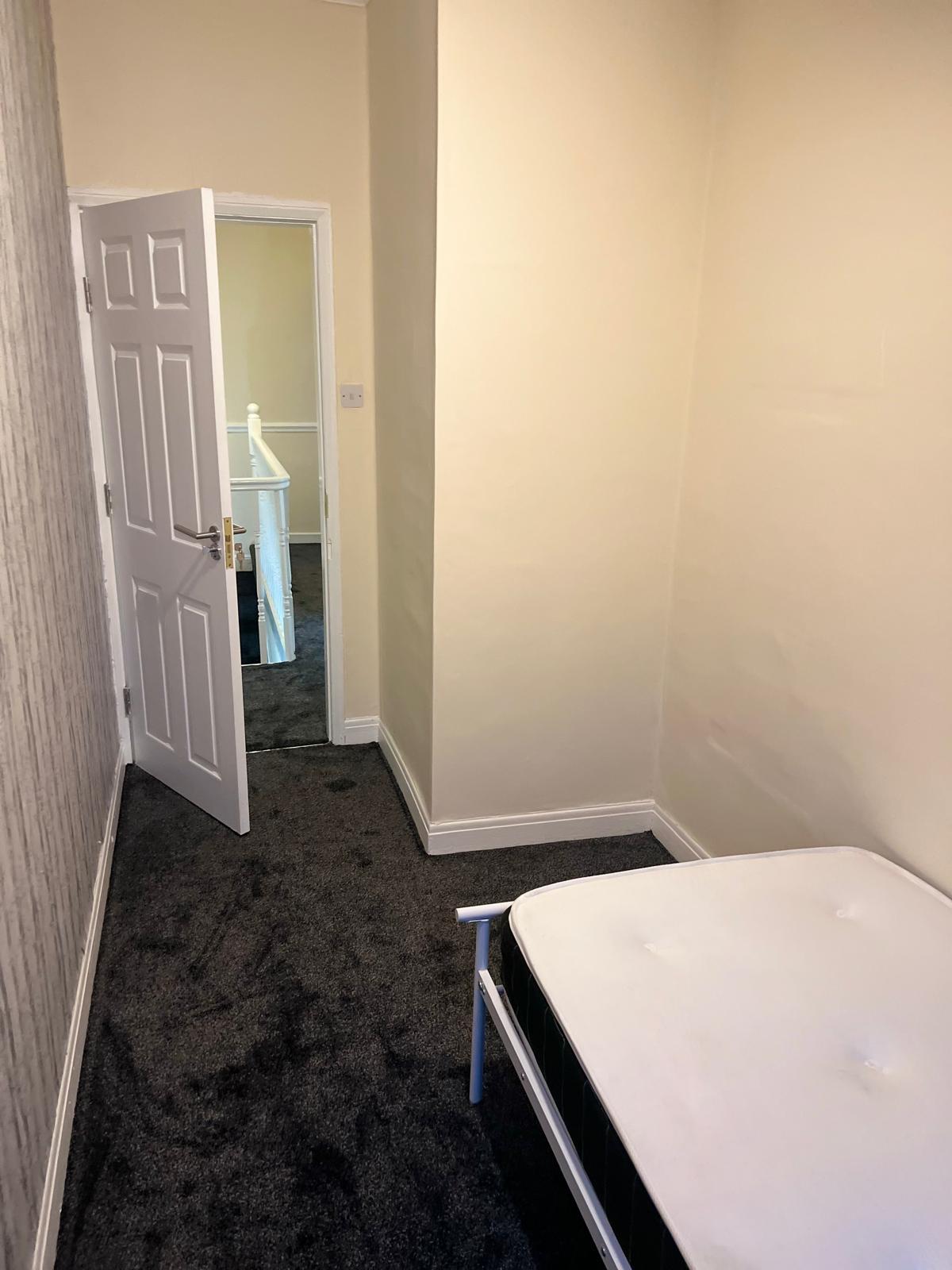 Refurbished bedroom with new carpet and joinery