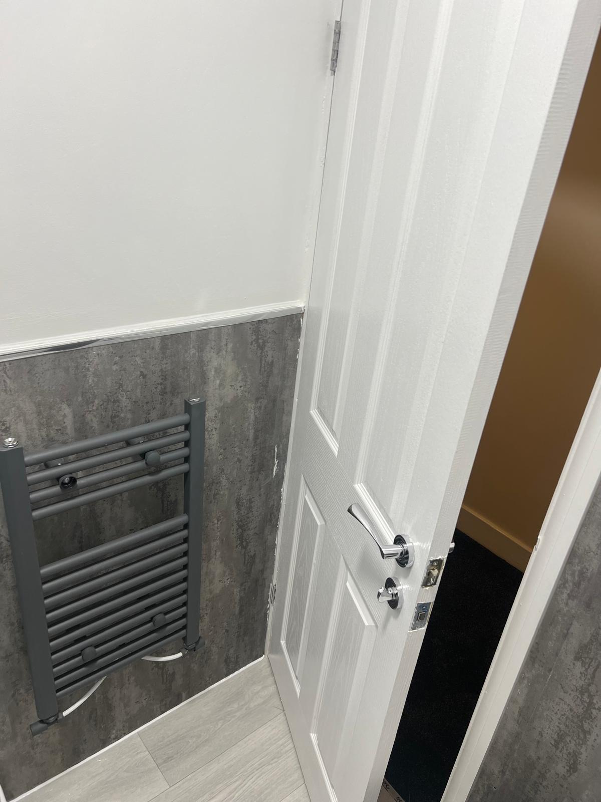 Heated towel rail and newly fitted bathroom finishes